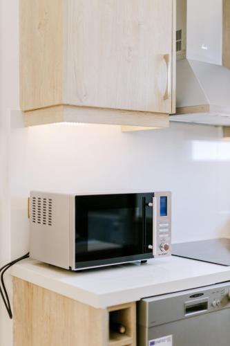 a microwave oven sitting on top of a counter at The Three Graces in Antimácheia