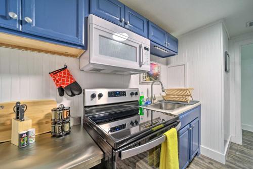 a kitchen with a stove and a microwave at Multi-Unit Brevard Vacation Rental with Patio! in Brevard