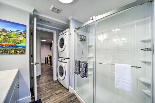 a bathroom with a washing machine and a glass shower at Multi-Unit Brevard Vacation Rental with Patio! in Brevard