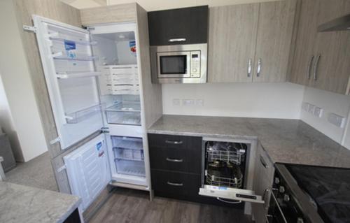 Kuchyň nebo kuchyňský kout v ubytování Homeston Lodge