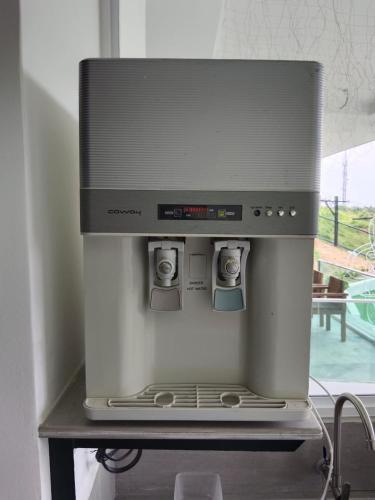 a stove top oven sitting on top of a table at I Do Farmstay in Bukit Mertajam