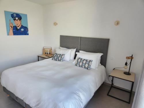 Ένα ή περισσότερα κρεβάτια σε δωμάτιο στο Villa HOME HOLIDAY à Cala Rossa