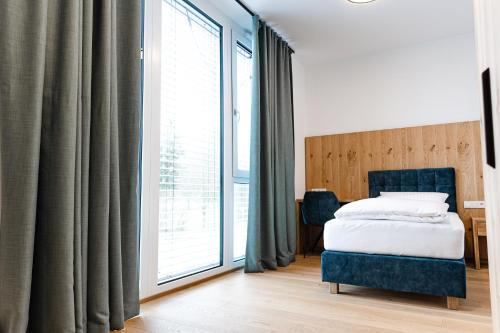 Postel nebo postele na pokoji v ubytování Boardinghouse Plattling