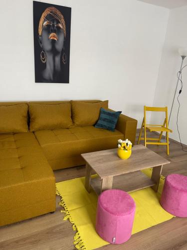 a living room with a couch and a table at Dedina kuća in Gornji Milanovac