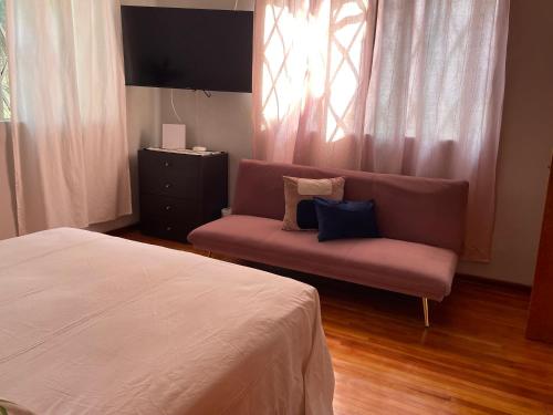 En eller flere senge i et værelse på Casa centríca accesible a los lugares más turísticos