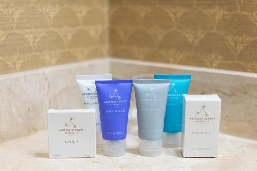 a group of four products sitting on a bathroom counter at The Towers at The Kahler Grand in Rochester