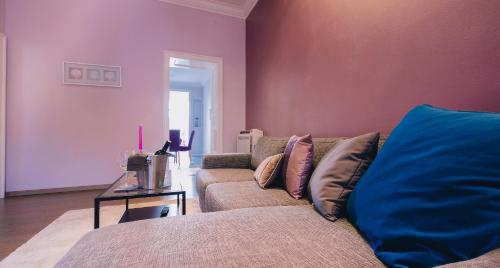 a living room with a couch and a table at Apartment for special getaway Nea in Pula