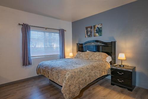 a bedroom with a large bed and a window at Black Forest Lodge in Big Bear Lake