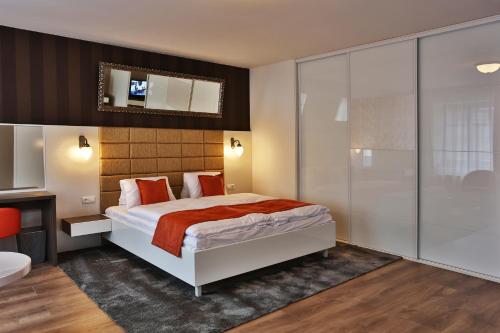 a large white bed in a room at VIP Apartments in Bratislava