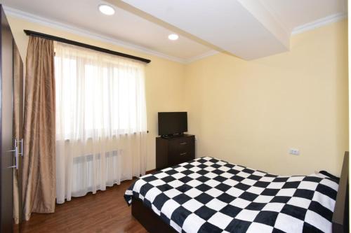 Llit o llits en una habitació de Saryan 40