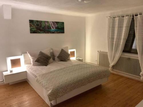 a bedroom with a bed and a window at Appartement für bis zu 8 Personen in Amstetten in Amstetten