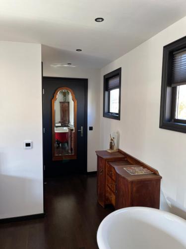 a bathroom with a sink and a mirror at Morpheus in Amsterdam