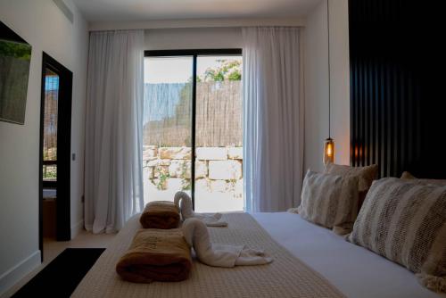 a bedroom with a teddy bear laying on a bed at Casa Bodhi Boutique Hotel & Spa in Marbella