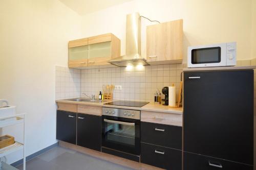Kuchyň nebo kuchyňský kout v ubytování Dein Flughafen Messe Apartment nahe Düsseldorf 2