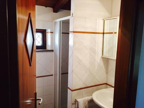 a small bathroom with a sink and a toilet at Chalet La Sequoia Orte zona terme in Orte