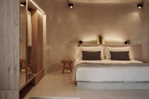 a bedroom with a large white bed in a room at Naxea Villas I in Plaka