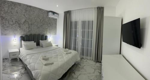 Cama ou camas em um quarto em UJVARA HOTEL