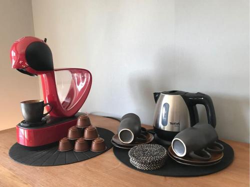 a counter with a coffee maker andocolates on a table at De Cordobahoeve in Tweede Exloërmond