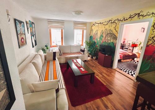 a living room with a couch and a table at Apartment Centar in Sarajevo