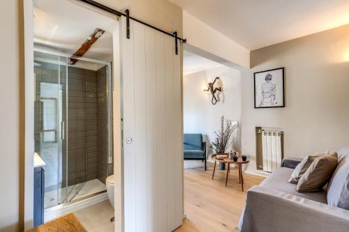 a room with a glass door leading to a bathroom at RR Apartments San Giovanni in Rome