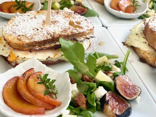a plate of food with a sandwich and a salad at Domaine Chardonnay in Temecula