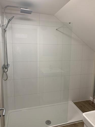 a shower with a glass door in a bathroom at The Beach Pad North Berwick in North Berwick