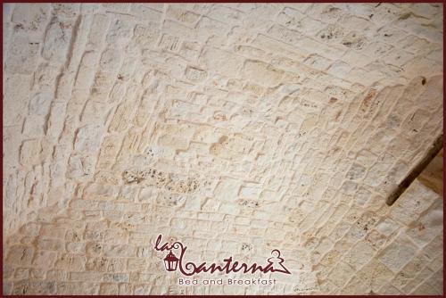 a close up of a writing on a wooden table at "B&B La Lanterna" Trulli & Dimore Storiche in Alberobello