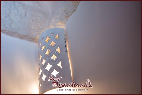 a close up of a shoe on top of a ceiling at "B&B La Lanterna" Trulli & Dimore Storiche in Alberobello