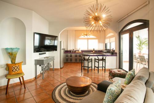 a living room with a couch and a table at Villa Cobojo in Bucerías