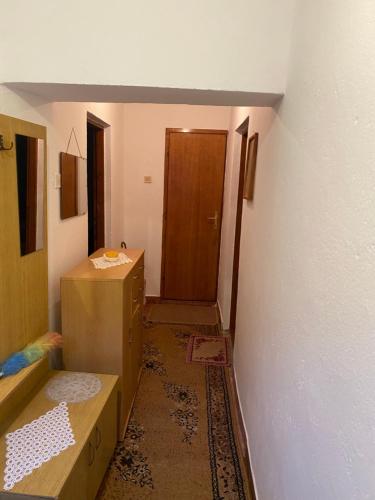 a room with a hallway with a door and a room with at Stolac Home River in Stolac