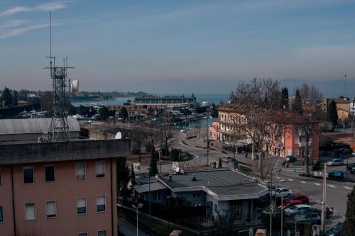 a view of a city with buildings and a street at K MODERN HOTEL in Peschiera del Garda