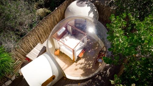 an aerial view of a house in a glass dome at Astral Tulum in Tulum
