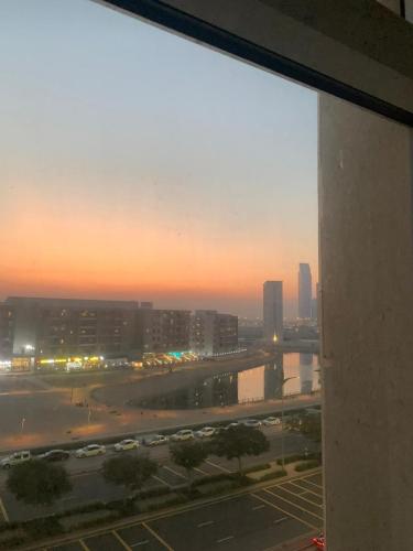 a view of a city skyline from a window at One Bedroom Apartment- IMPZ in Dubai