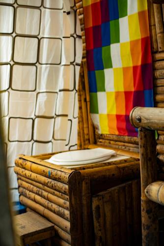 a colorful shower with a toilet in a room at Cabaña Eco amigable en medio de la montaña. in Pastales