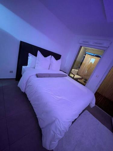 Кровать или кровати в номере La suite