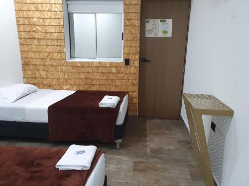 Postel nebo postele na pokoji v ubytování Hotel Prestige