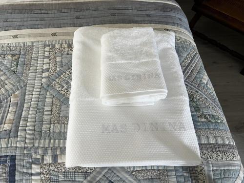 a white napkin sitting on top of a bed at Charming, chic, secluded villa within walking distance from Lorgues in Lorgues