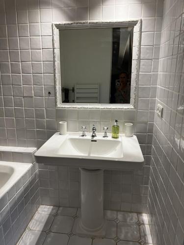 a white bathroom with a sink and a mirror at Charming, chic, secluded villa within walking distance from Lorgues in Lorgues