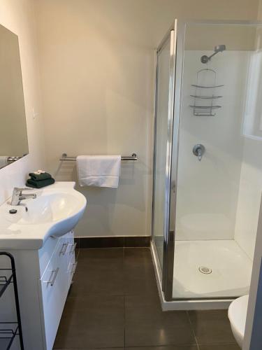 a bathroom with a shower and a sink at Mansfield Country Resort in Mansfield