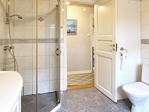 a bathroom with a shower and a toilet at 8 person holiday home in Uddevalla-By Traum in Uddevalla