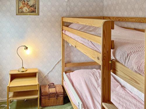 7 person holiday home in NYNÄSHAMN-By Traumにあるベッド
