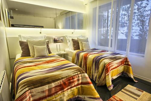 a bedroom with two beds and a window at Istanbul Irini Seaview House in Istanbul