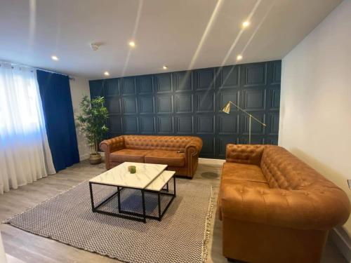 a living room with a couch and a table at 17A Stella house nr Bath in Radstock