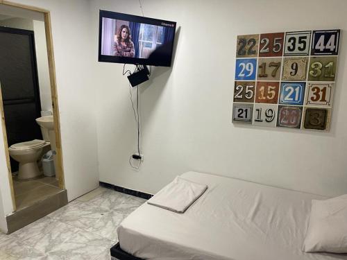 Cama o camas de una habitación en Cómodo apartaestudio con ubicación central 1B