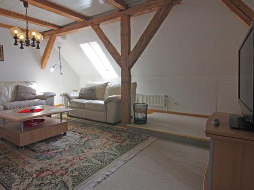Ruang duduk di Ferienwohnung im Gutshaus Schulenbrook