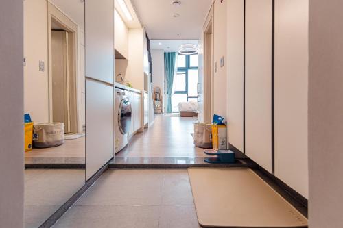 a hallway of a house with a rug on the floor at Ocean Marina Suite View in Yeosu
