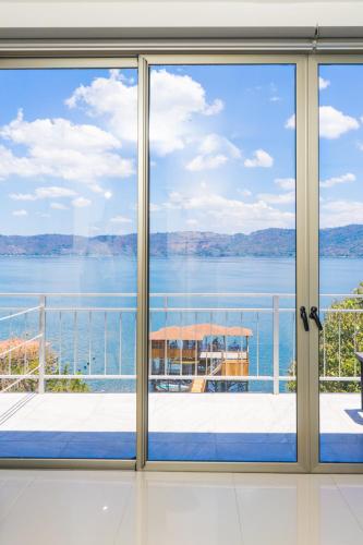 a room with a view of the water seen through a window at Equinoccio Hotel in Santa Ana