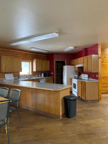 a kitchen with a large island in the middle at Soldotna Lodge in Soldotna