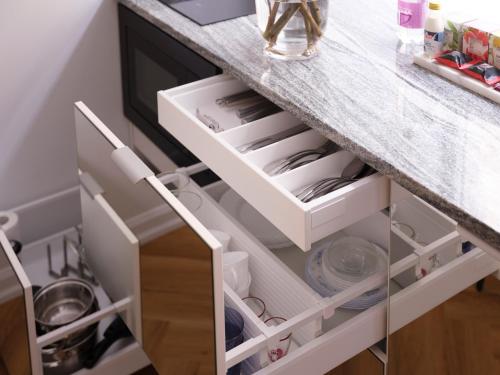 a kitchen counter with white drawers at MIRO Rooms - quiet chic, free parking, self check-in in Rīga