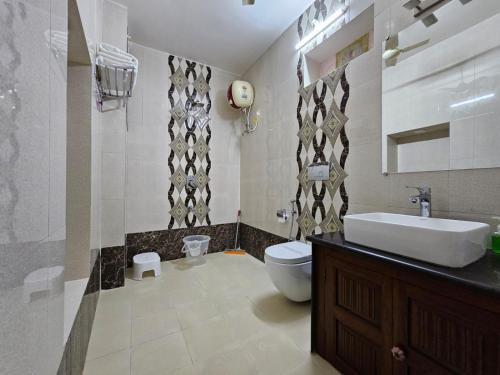 a bathroom with a sink and a toilet at Khamma Heritage in Jodhpur